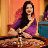 PG Soft live-dealer studio with professional croupier and HD camera setup